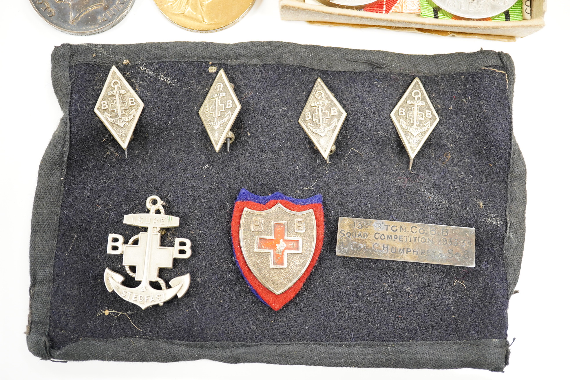 Twelve medals including; a First World War pair to Pte. C.F. Humphreys R. Sussex Reg., and three WWII medal groups, two in original card issue boxes and including the Burma star, the Africa star, etc. plus a few other it